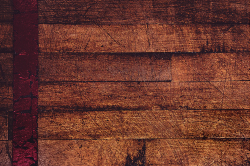 4 Pesky Areas of the House That Get Marked up and How to Renew Them 1 an old hardwood floor, marked up with age.