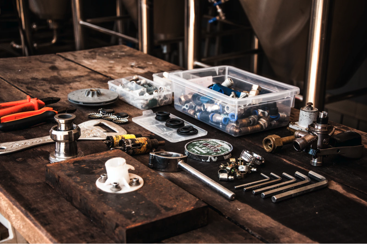 A picture of a table with lots of different plumbing equipment on it.