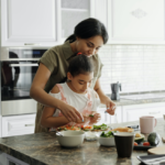 Mother and daughter cooking together