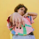 playful chubby woman in colorful shirt