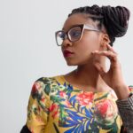 photo of woman wearing yellow floral top