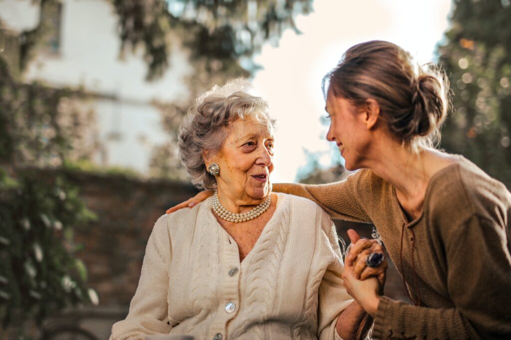 3 Ways to Support Older Family Members 1 joyful adult daughter greeting happy surprised senior mother in garden
