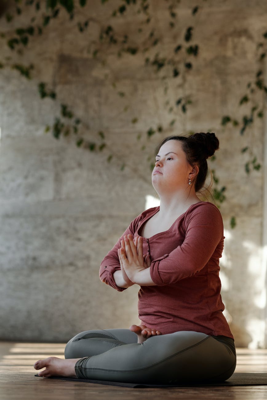 photo of young woman in a yoga position