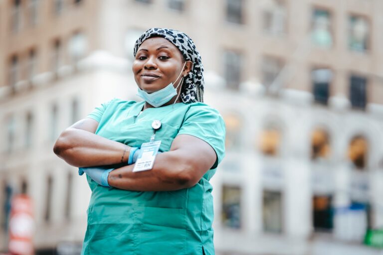 black woman in uniform on street