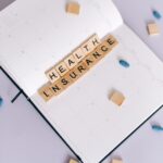 health insurance scrabble tiles on planner