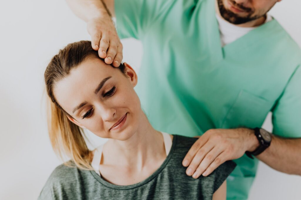 3 Ways to Help Manage Your Chronic Pain Without Medication 1 professional massage therapist treating a female patient s injured neck