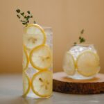 glasses with lemon drink on table