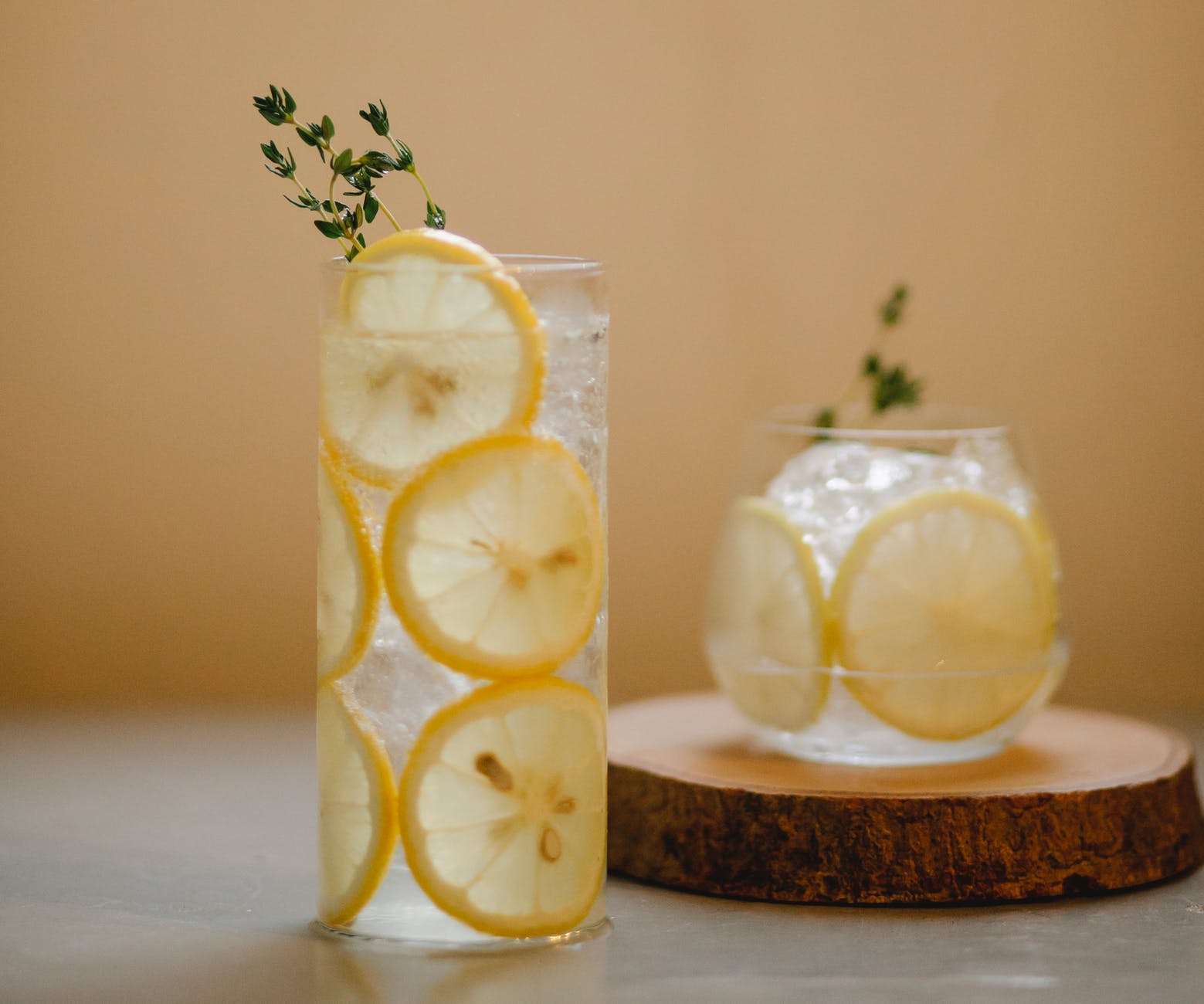 glasses with lemon drink on table