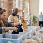 woman with dreadlocks sorting clothes