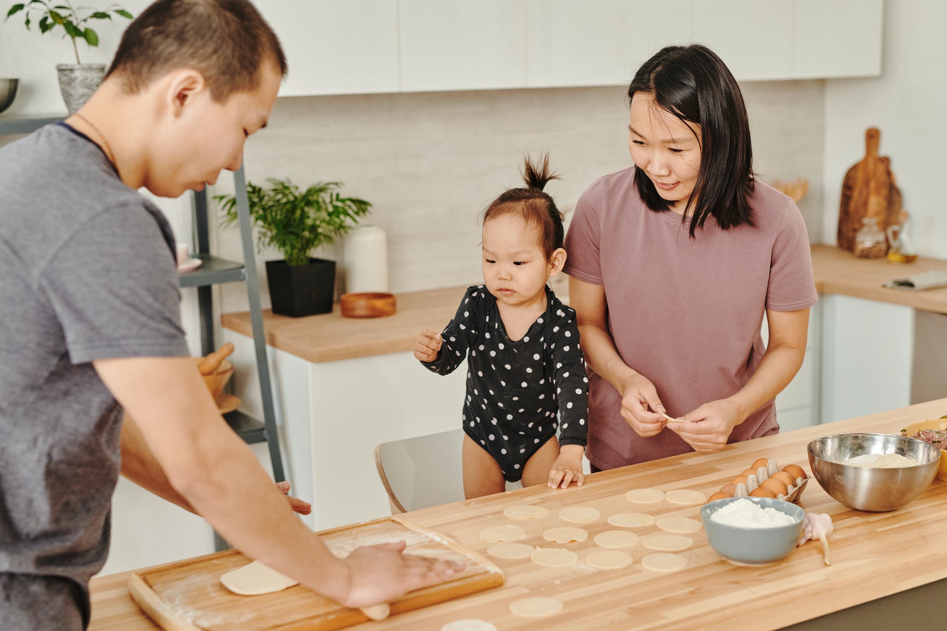 asian family preparing food together