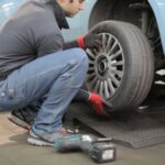 man changing a car tire