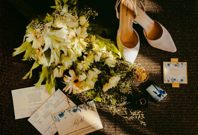 pair of beige shoes beside bouquet