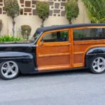 vintage black and brown station wagon