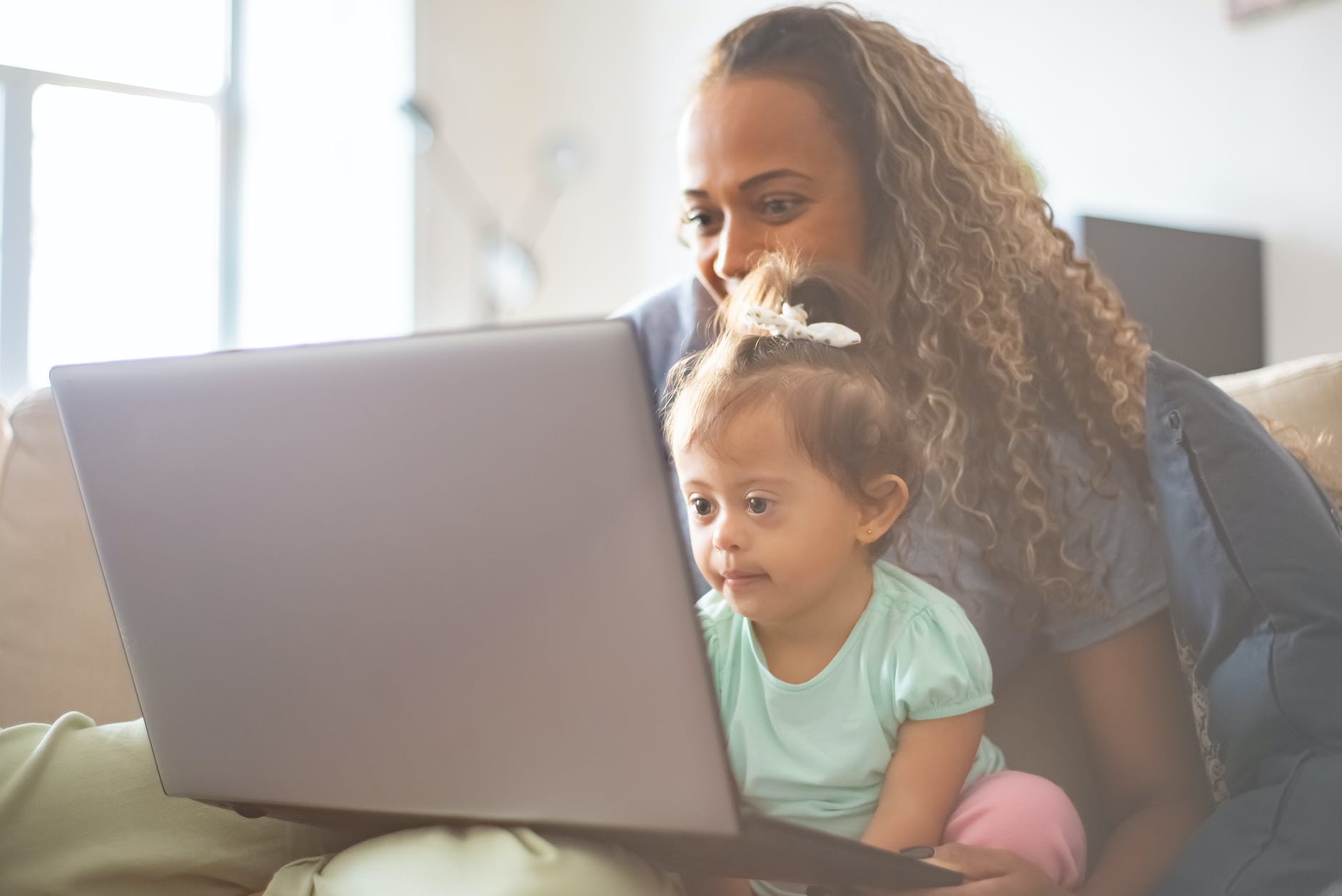 mother and daughter using a laptop
