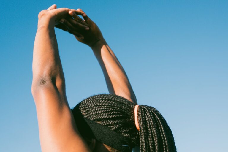 person raising her hands