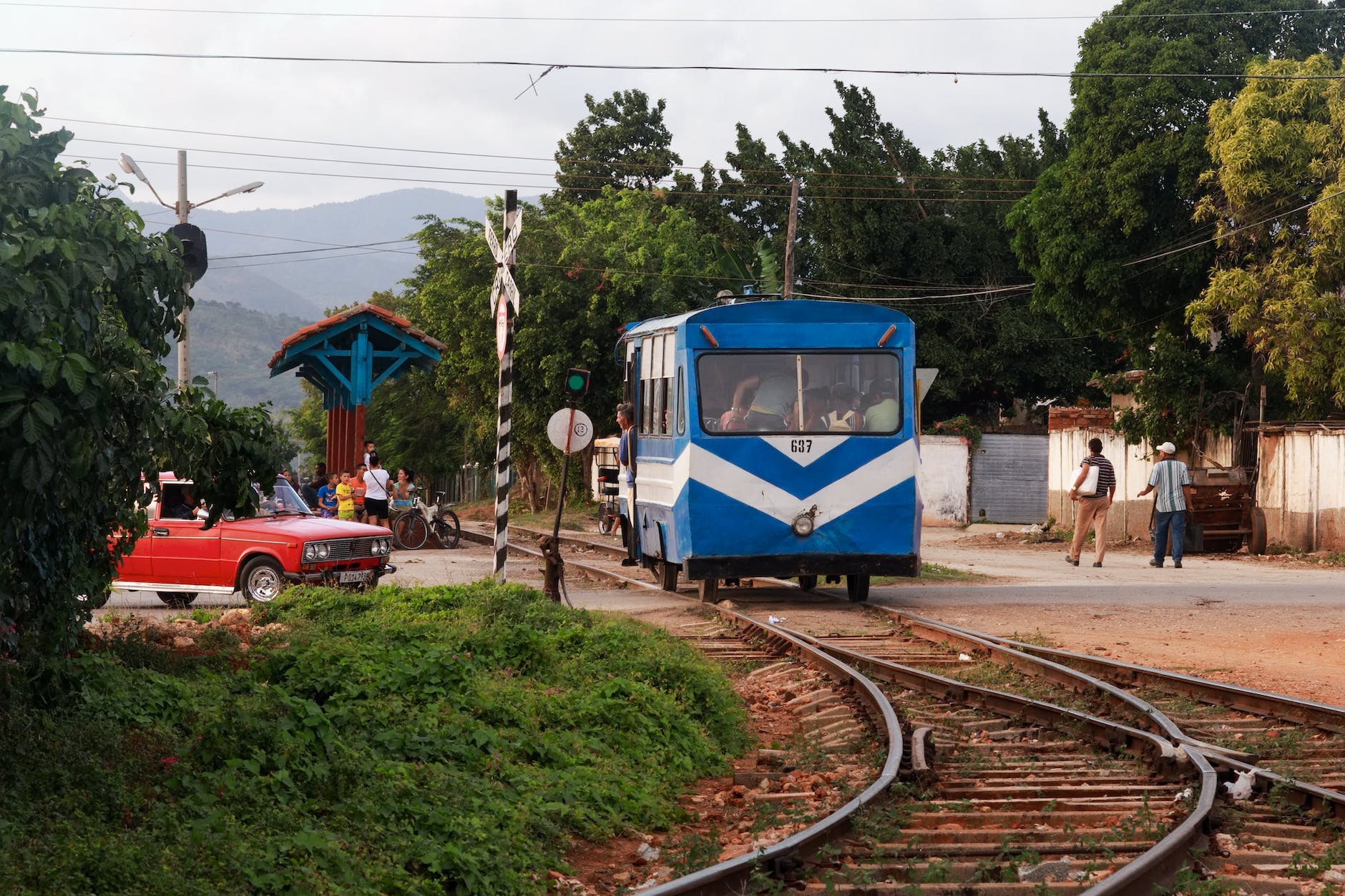blue train on rail tracks