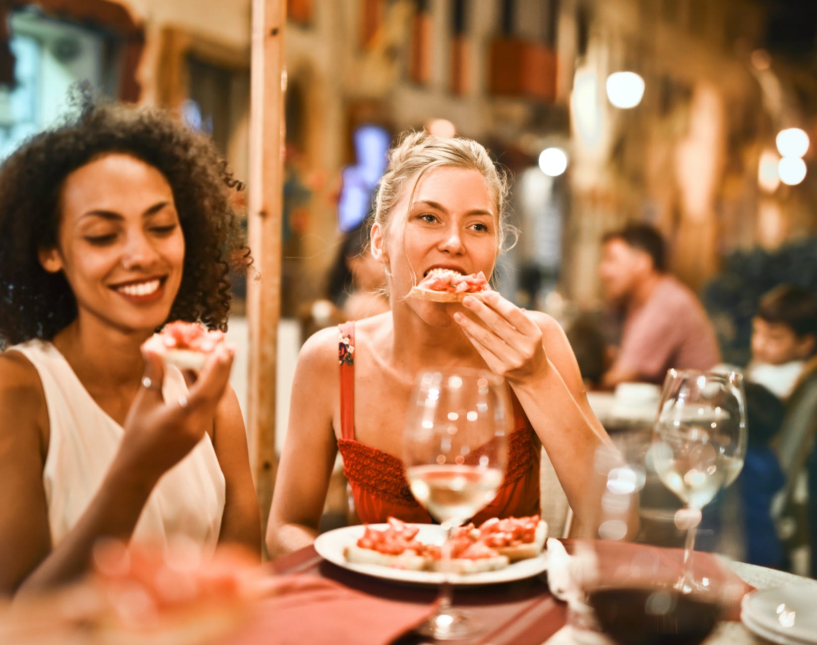 woman eating bruschetta