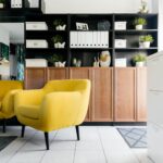interior of stylish living room with yellow soft furniture