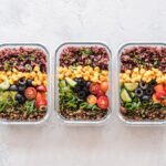 Three meals prepped in Tupperware