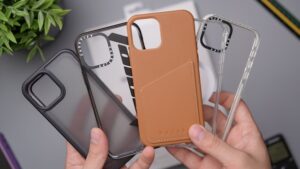 four different iphone cases being held