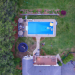 Aerial view of an outdoors, backyard pool