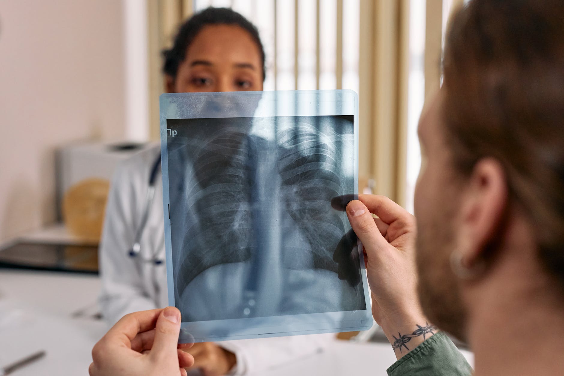 a man holding an x ray result