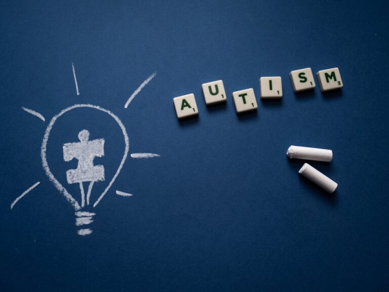 scrabble tiles and chalk on blue background