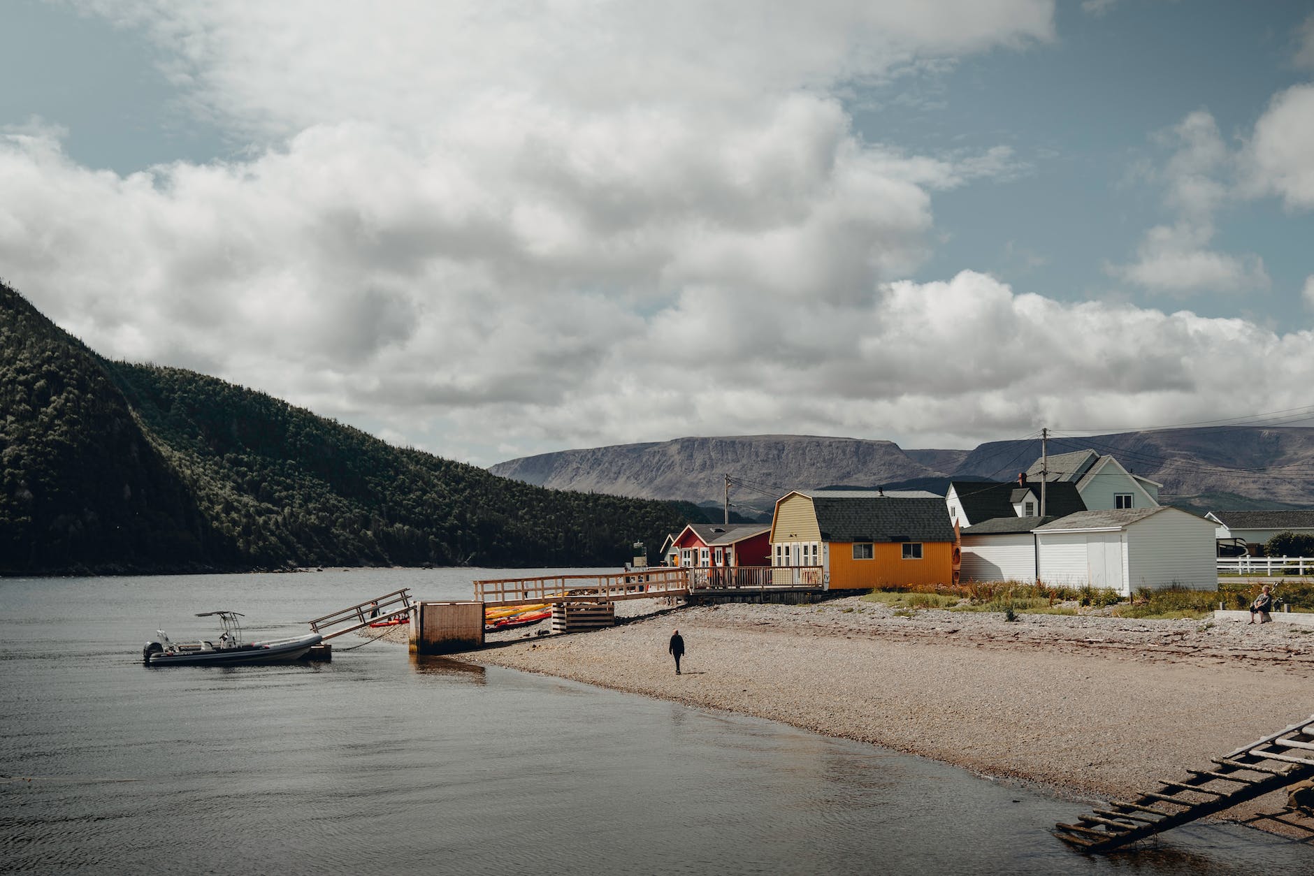 houses beside river and mountains