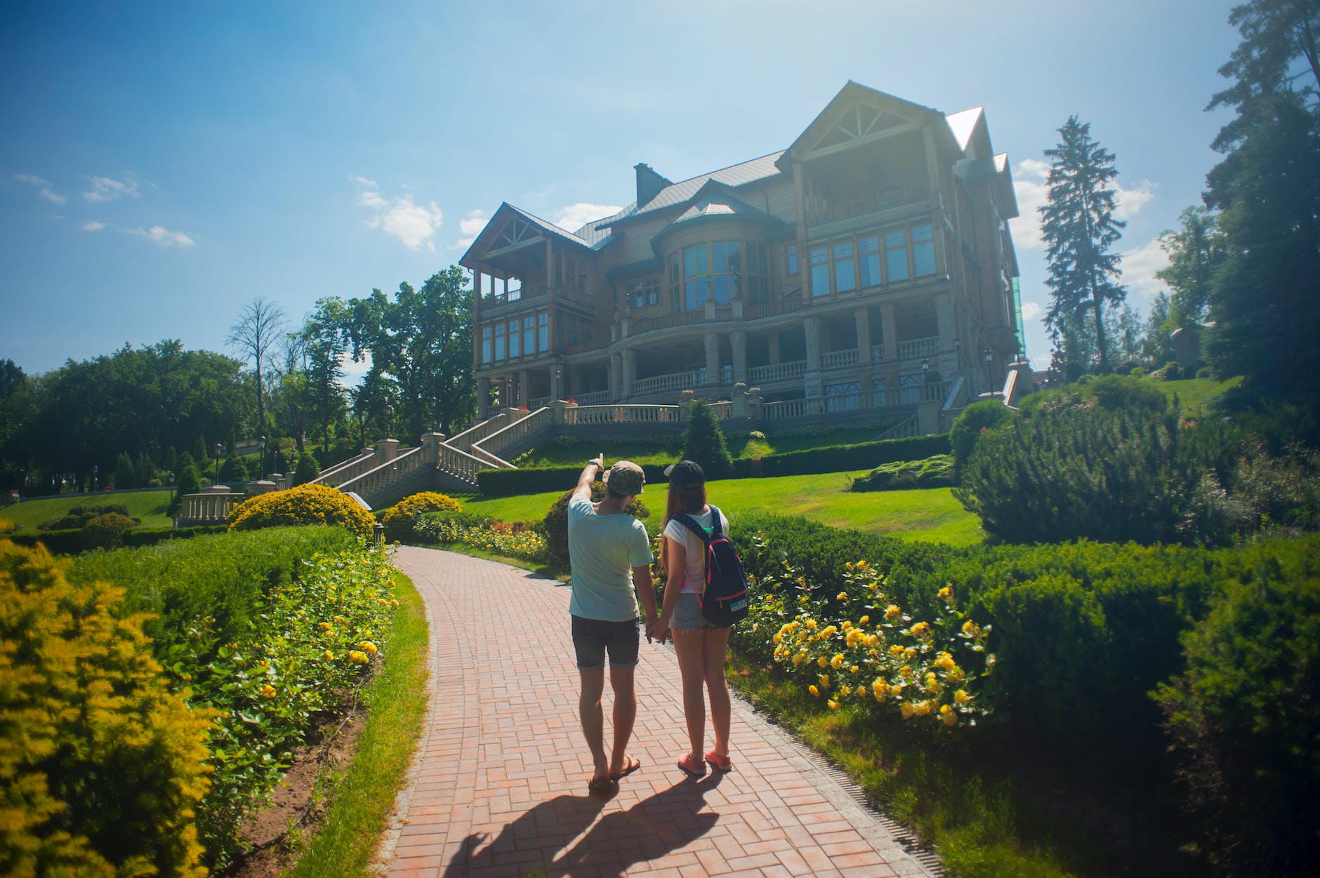 photo of couple standing outside the house