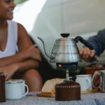 crop friends preparing coffee and boiling kettle on gas stove