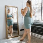 a plus size woman in gray tank top