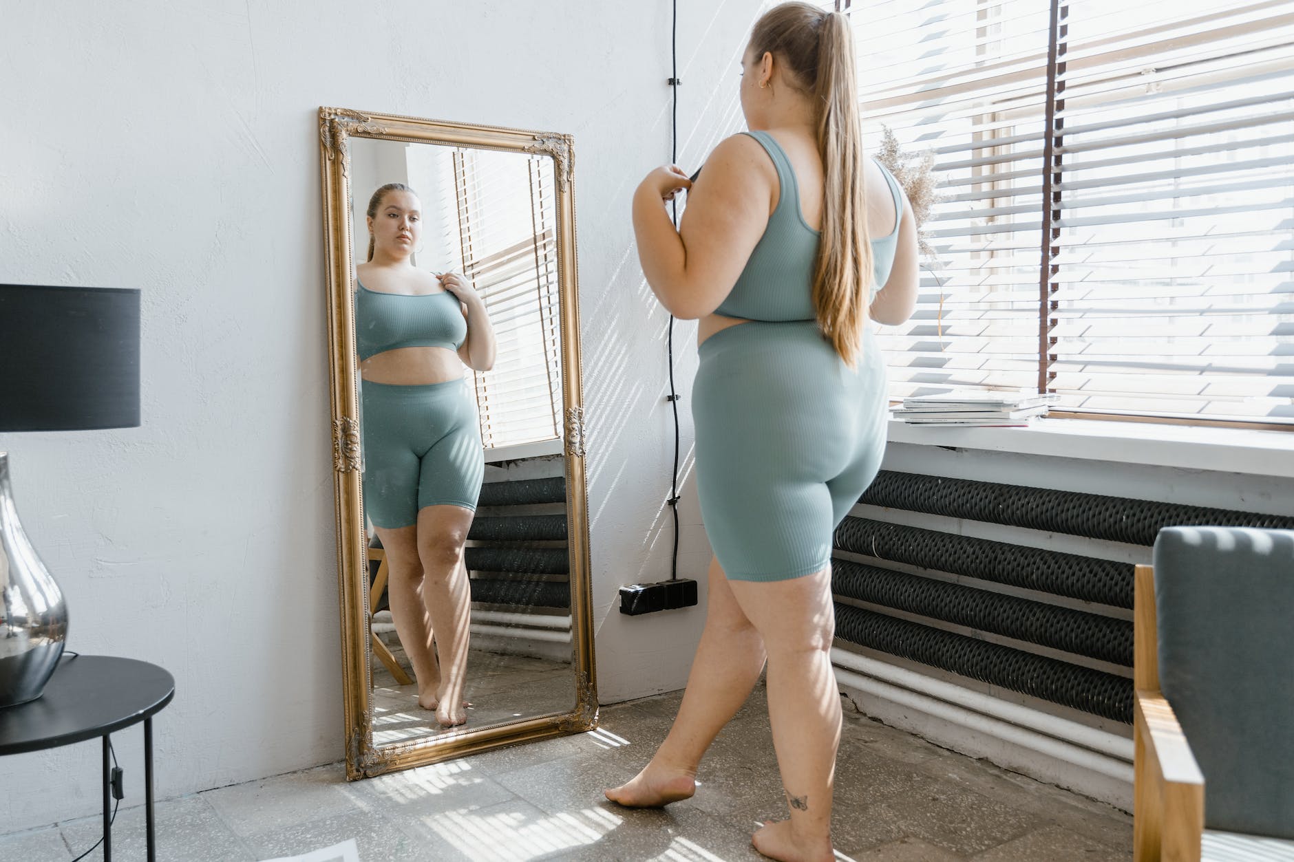 a plus size woman in gray tank top