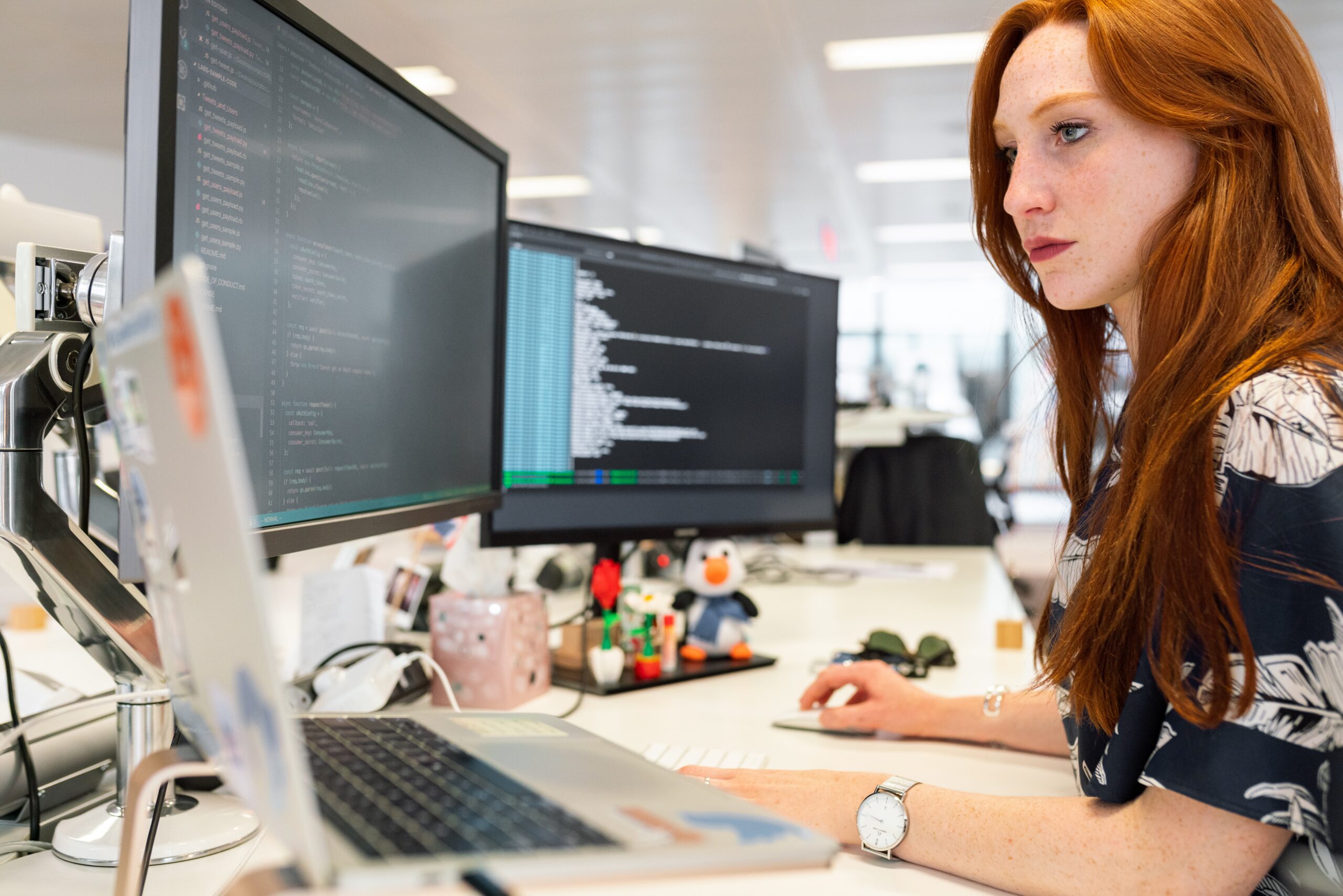 Young woman sitting at computer.