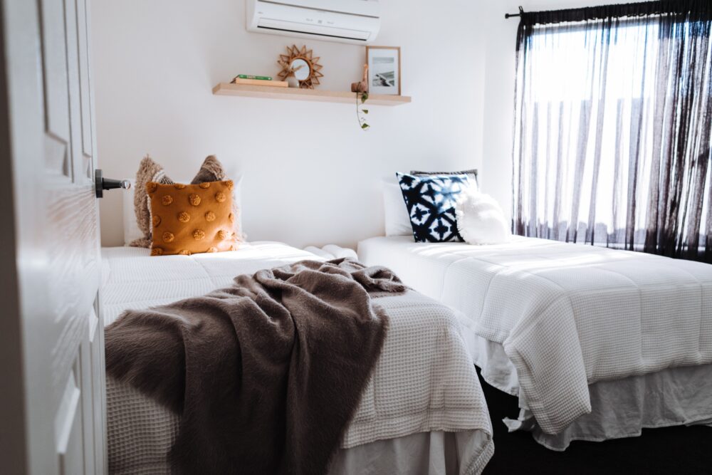 Two twin beds in a bedroom.