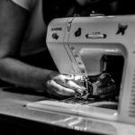 A person using a sewing machine