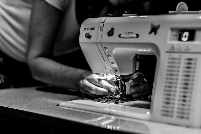 A person using a sewing machine