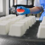 Person in factory making food.