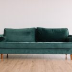A couch in an otherwise bare room