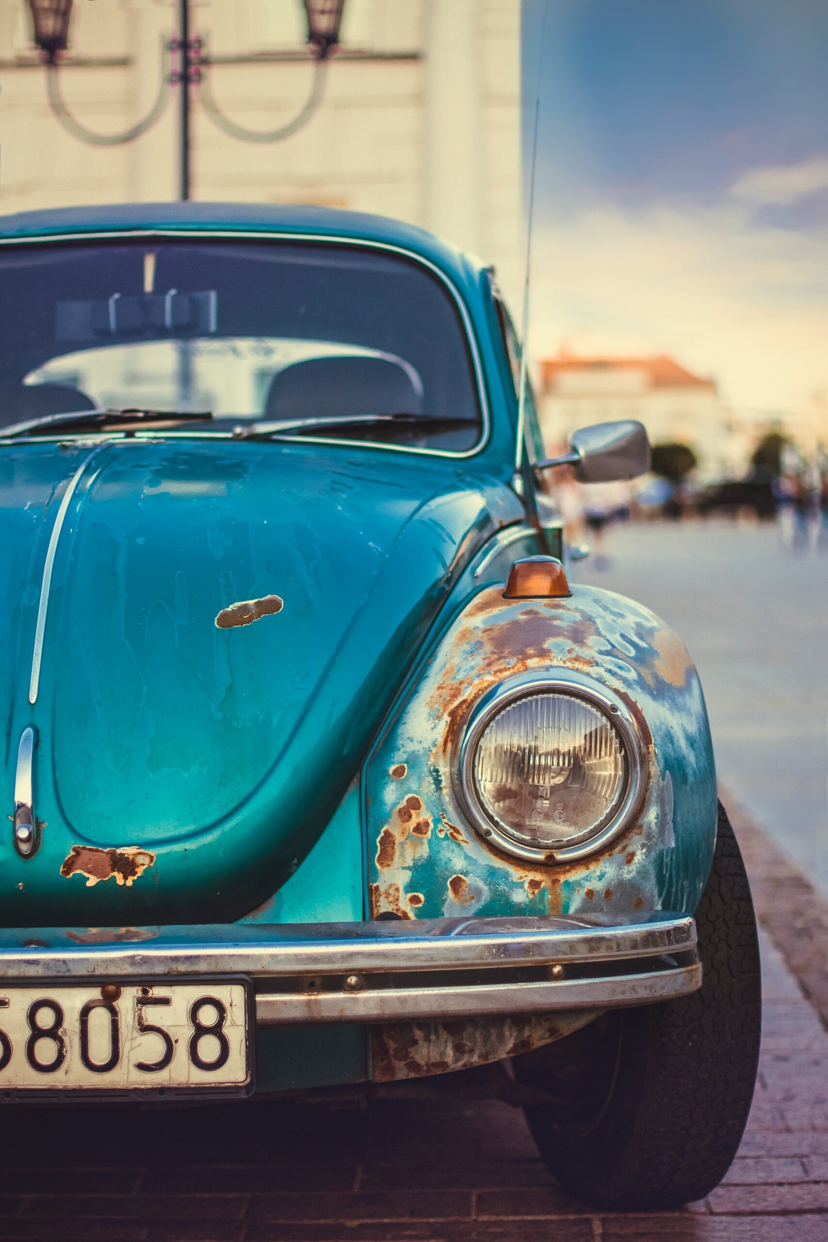 A rusted, old car.