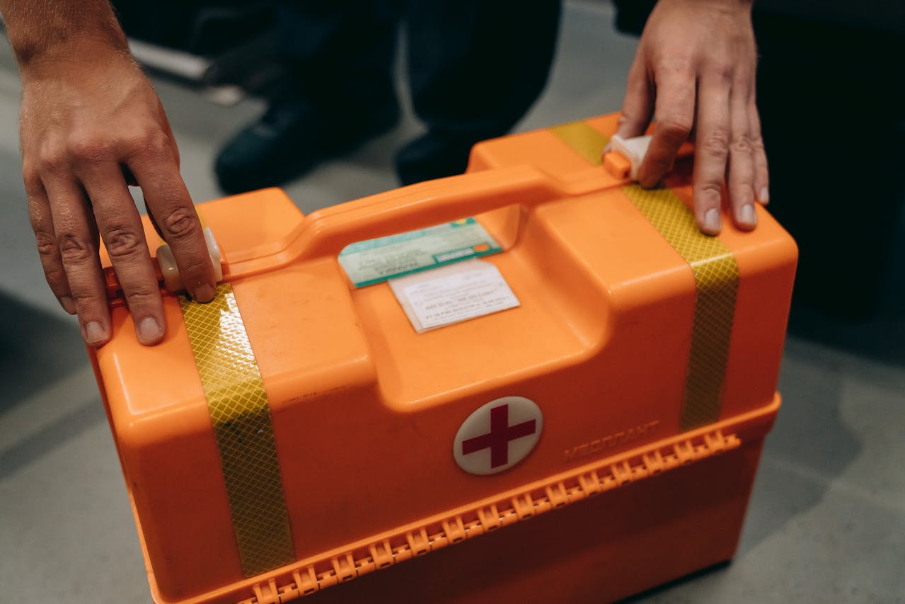 Someone checking a portable crate of medical supplies.