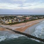 an aerial view of a beach and ocean