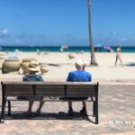 Two retirees on a beach