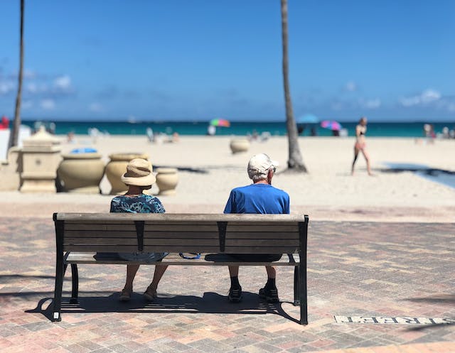 Two retirees on a beach