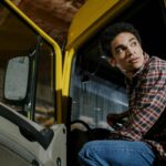 low angle shot of a man sitting in a truck