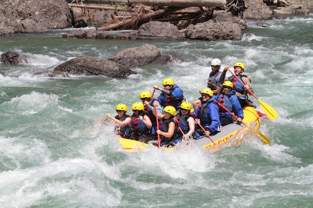 A group of people having fun rafting