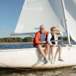 mature couple sitting on the sail boat