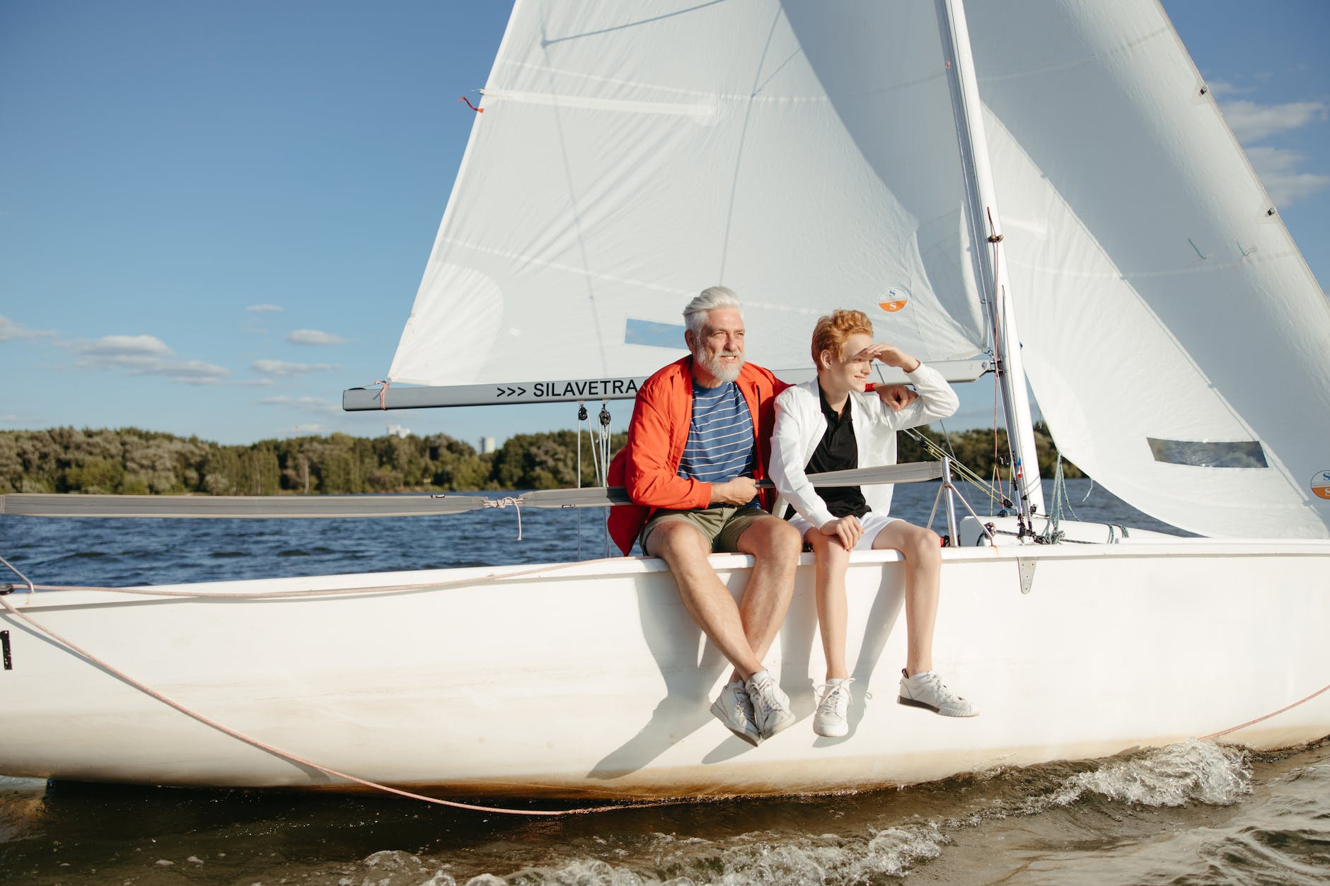 mature couple sitting on the sail boat