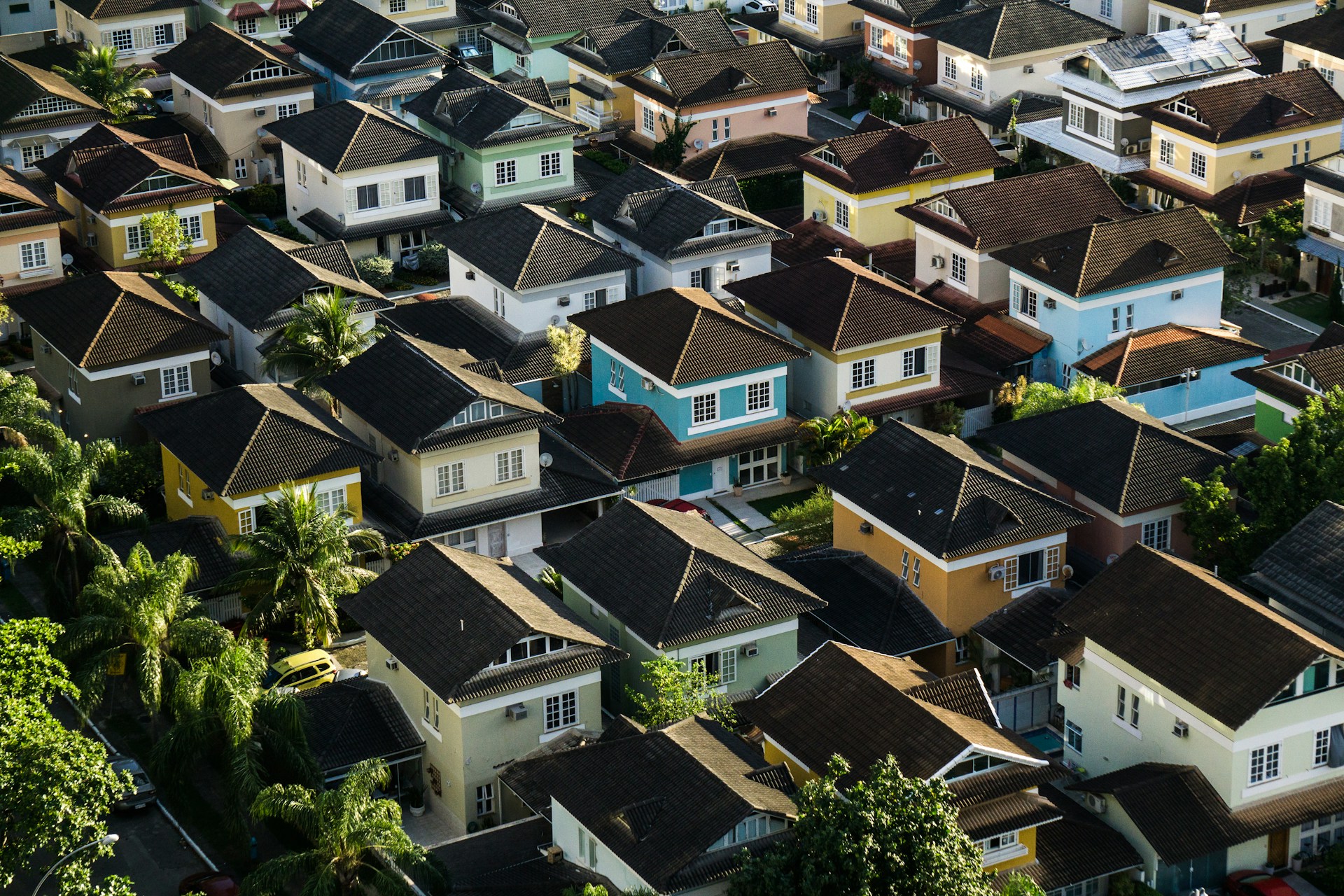 A densely packed neighborhood of homes viewed from above.