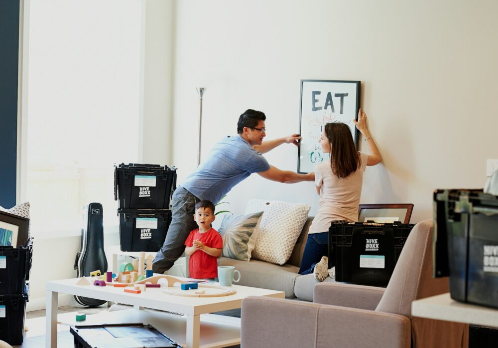 A family decorating their home after moving in.