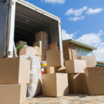 A moving truck with boxes of items.